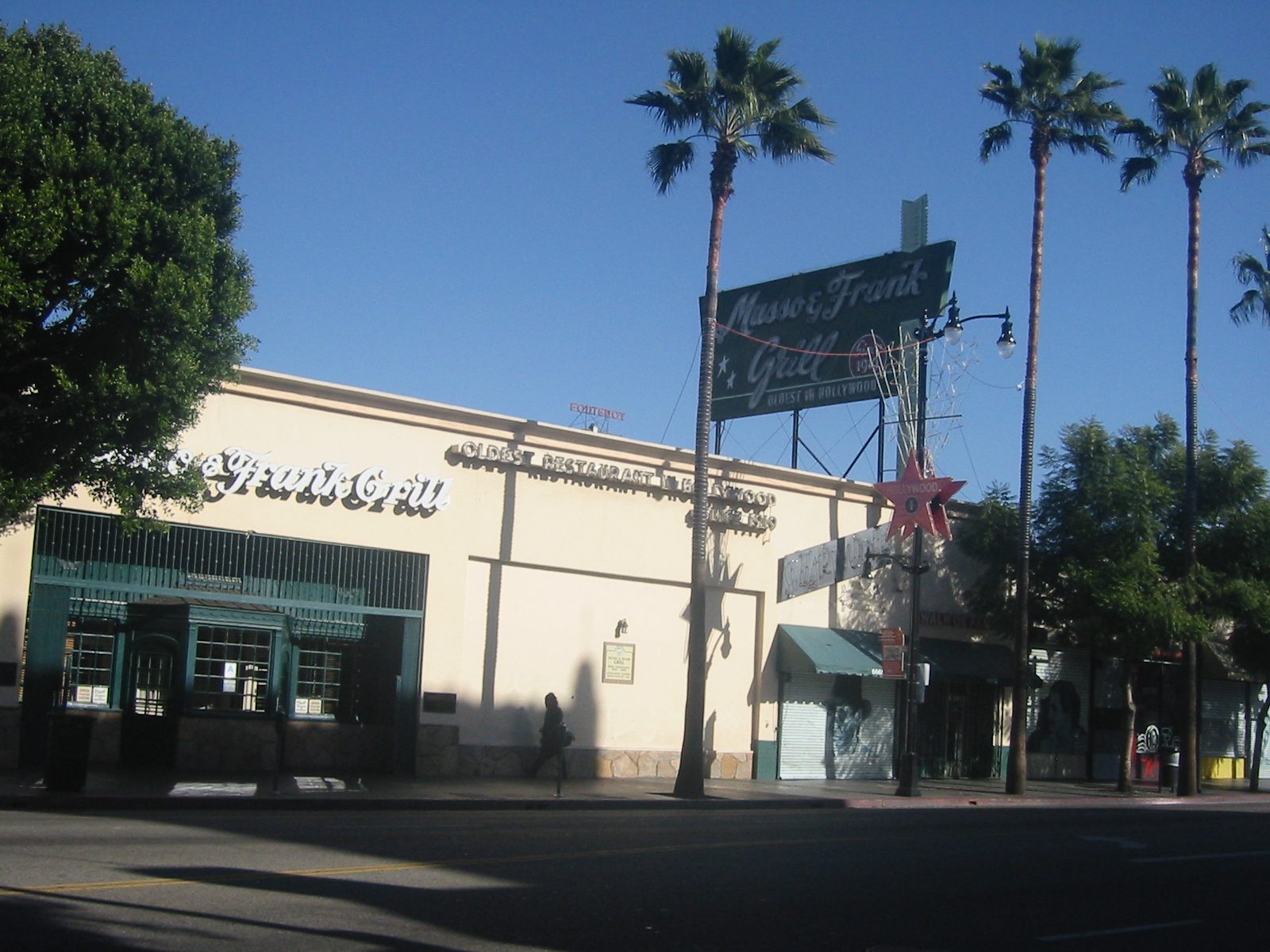Musso & Frank Grill's facade and its Oldest in Hollywood blade sign on Hollywood Boulevard